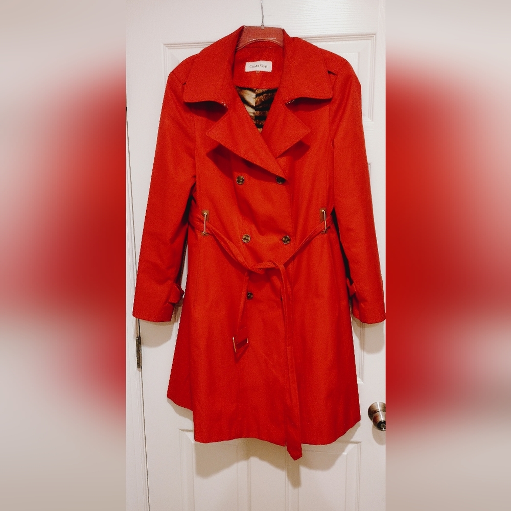 Red Calvin Klein raincoat